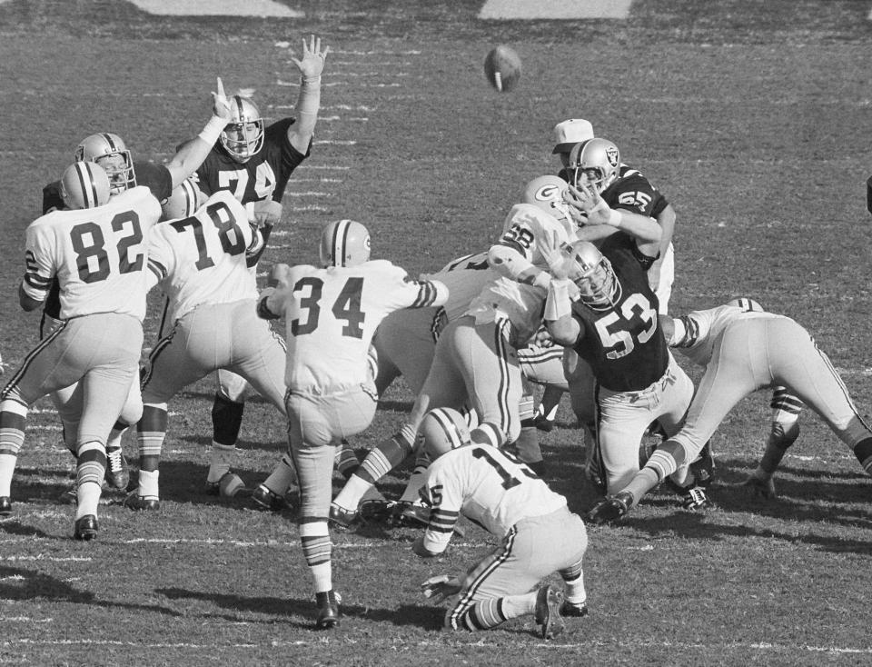 1968: Don Chandler (34) of the Green Bay Packers kicks the first field goal in Super Bowl II against the Oakland Raiders in Miami.