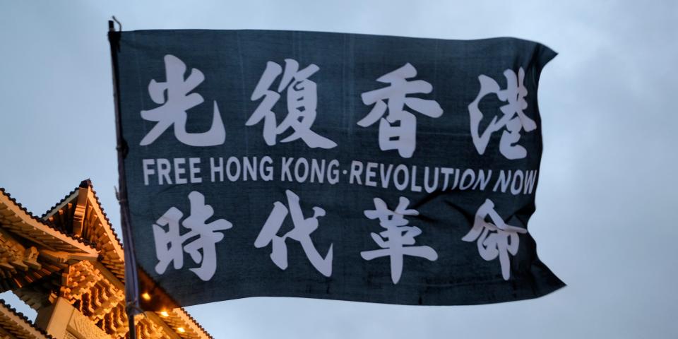 LIBERTY SQUARE, TAIPEI, TAIWAN - 2020/06/13: A flag with written on it: Free Hong Kong Revolution waved in front of Taipei Chiang Kai Sheck memorial.A group of mostly young Taiwanese and Taiwan expatriates Hongkongers demonstrate against China rule on the territory in Liberty Square downtown Taipei. The demonstration, one of the many held in Taiwan, was set to commemorate the anniversary, one year, since the protest started in Hong Kong against several laws that were to be implemented in Hong Kong. (Photo by Alberto Buzzola/LightRocket via Getty Images)