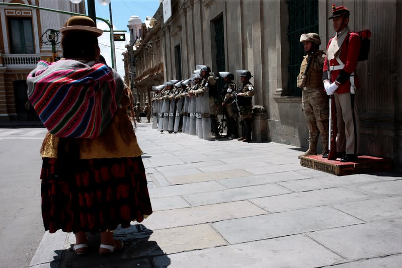 Military police officers keep watch outside the old presidential palace in La Paz