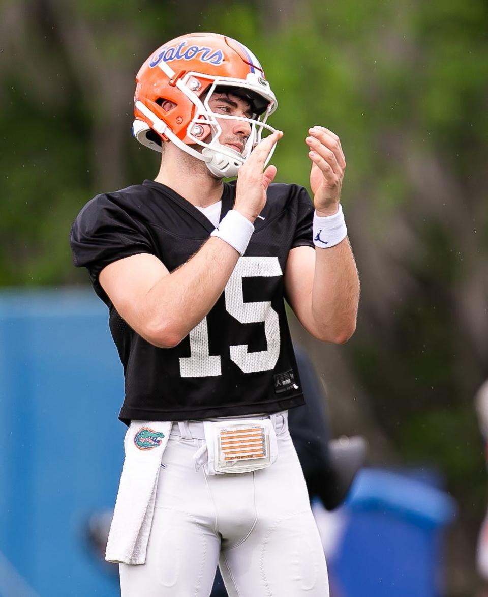 Florida Gators quarterback Graham Mertz (15) claps during the first day of spring practice on March 4 in Gainesville.