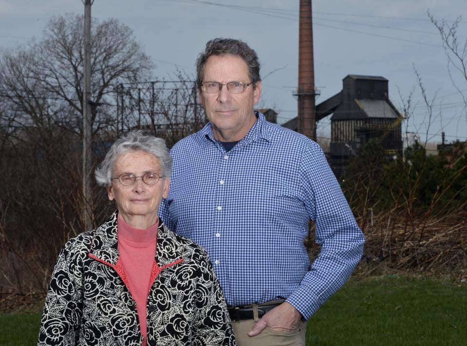 Hold Erie Coke Accountable leaders, from left, Erie Benedictine Sister Pat Lupo and Michael Campbell stand near the Erie plant inthis file photo taken on April 18, 2019. [GREG WOHLFORD/ERIE TIMES-NEWS]