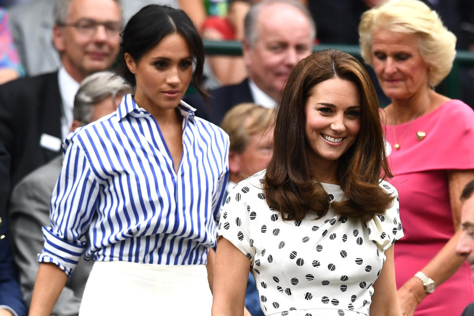 Kate Middleton and Meghan Markle on day twelve of the Wimbledon Lawn Tennis Championships at All England Lawn Tennis and Croquet Club on July 14, 2018 in London, England.