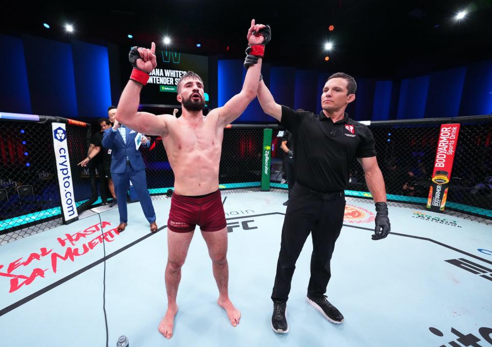Nazim Sadykhov celebrates his third-round knockout..jpg