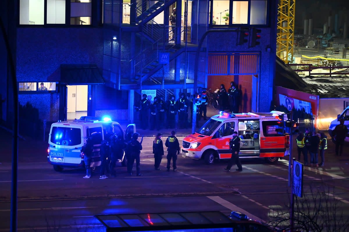 Police mass outside the site of an alleged church centre shooting in Hamburg, Germany, on 9 March, 2023  (AP)