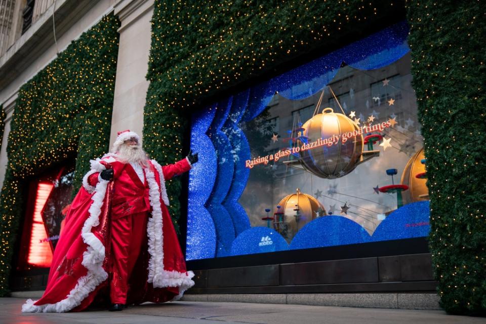 A man dressed as Santa Claus outside Selfridges in London as the department store unveils its Christmas windows (Aaron Chown/PA) (PA Wire)