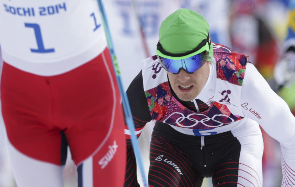 In this Feb. 9, 2014 photo Austria's Johannes Duerr competes during the men's cross-country 30k skiathlon at the 2014 Winter Olympics in Krasnaya Polyana, Russia. Duerr has been kicked out of the Sochi Games after testing positive for EPO, the country's Olympic committee said Sunday, Feb 23, 2014. It is the fifth doping case of the Olympics and the first involving the blood-boosting drug EPO. (AP Photo/Matthias Schrader)