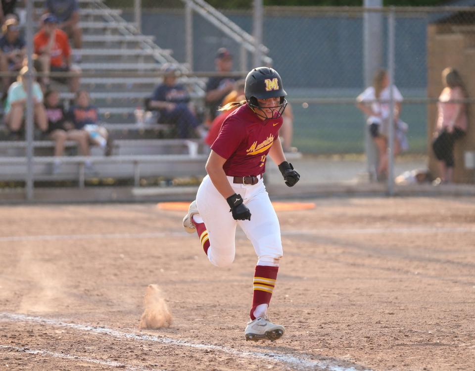 McCutcheon Mavericks Aubrey Miller (9) runs to first plate during the 2022-23 IHSAA Class 4A softball state tournament match against the Lafayette Jeff Bronchos, Tuesday, May 23, 2023, at Harrison High School in West Lafayette, Ind. McCutcheon won 12-5.