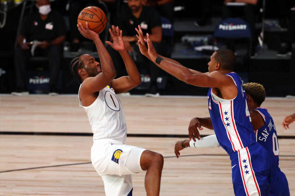 T.J. Warren #1 of the Indiana Pacers shoots the ball against Al Horford #42 of the Philadelphia 76ers.