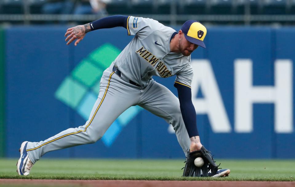 Apr 23, 2024; Pittsburgh, Pennsylvania, USA; Milwaukee Brewers second baseman Brice Turang (2) fields a ground ball for an out against Pittsburgh Pirates left fielder outfielder Jack Suwinski (not pictured) during the second inning at PNC Park. Mandatory Credit: Charles LeClaire-USA TODAY Sports