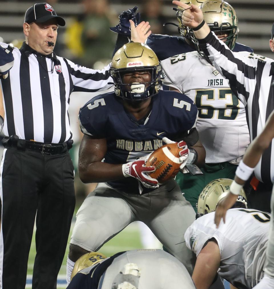 Archbishop Hoban High's Devin Bell celebrates recovering a fumble against St. Vincent-St Mary High during the Div. II regional semifinal football game at University of Akron's InfoCision Stadium in Akron on Friday.