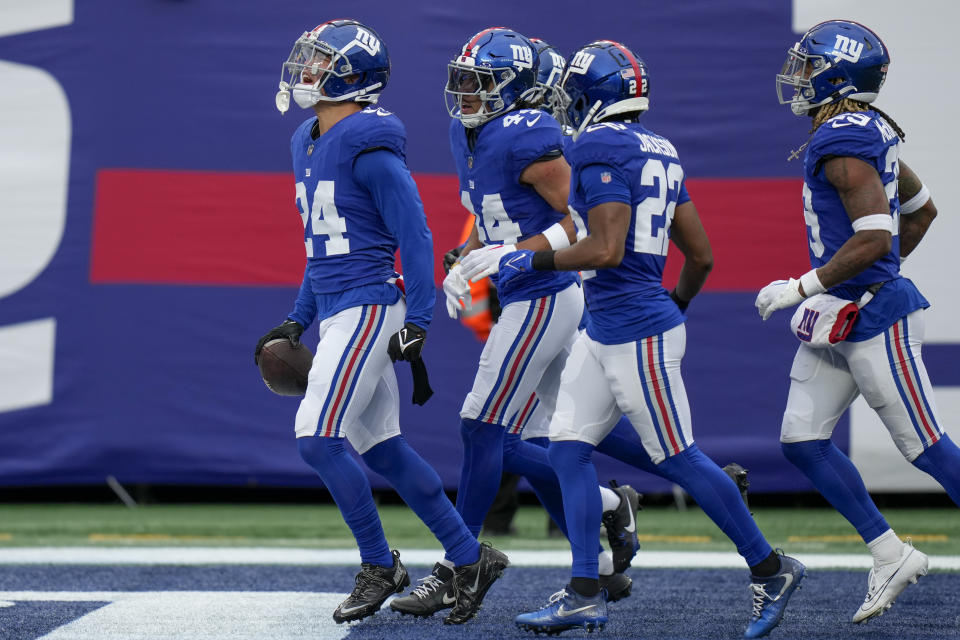 New York Giants safety Dane Belton (24) reacts after catching an interception off Los Angeles Rams quarterback Matthew Stafford (9) during the first half an NFL football game, Sunday, Dec. 31, 2023, in East Rutherford, N.J. (AP Photo/Seth Wenig)