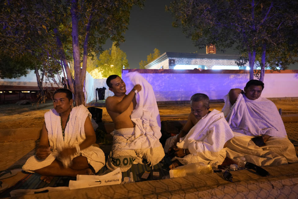 Muslim pilgrims rest at the Mina tent camp during the annual Hajj pilgrimage, near the holy city of Mecca, Saudi Arabia, Friday, June 14, 2024. Hajj is the annual Islamic pilgrimage to Mecca in Saudi Arabia that is required once in a lifetime of every Muslim who can afford it and is physically able to make it. Some Muslims make the journey more than once. (AP Photo/Rafiq Maqbool)