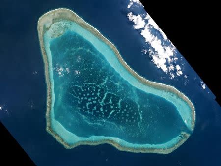 Boats at Scarborough Shoal in the South China Sea are shown in this handout photo provided by Planet Labs, and captured on March 12, 2016. REUTERS/Planet Labs/Handout via Reuters/File Photo