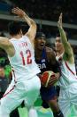 <p>Carmelo Anthony #15 of United States drives the ball around Gen Li #12 of China in the Men’s Preliminary Round Group A match on Day 1 of the Rio 2016 Olympic Games at Carioca Arena 1 on August 6, 2016 in Rio de Janeiro, Brazil. (Photo by Elsa/Getty Images) </p>