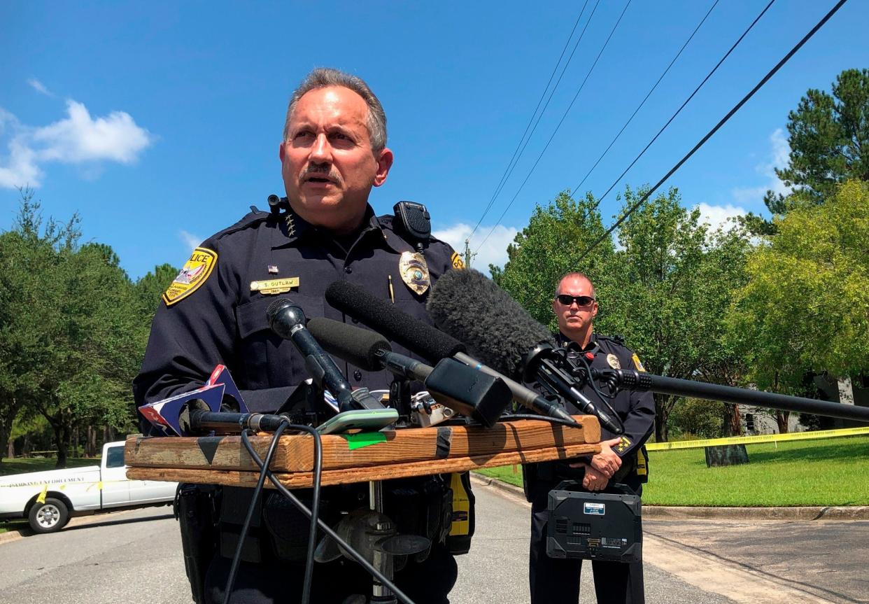 Steven Outlaw, acting police chief in Tallahassee, Florida, briefs reporters over the stabbing of five people at a building supply company: AP