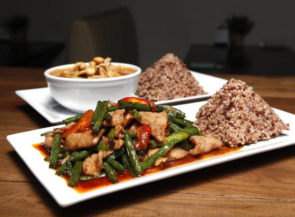 Pad Prik Khing (stir-fry with green beans, bell pepper, dried chili paste) and Massaman Curry at The Bangkok Thai Cooking and Bar in far north Fort Worth.