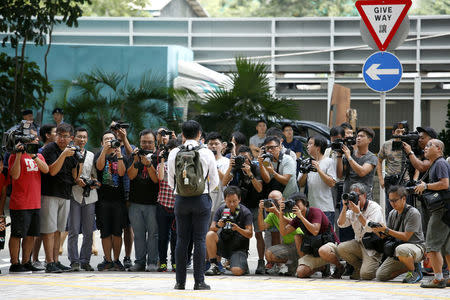 Former University of Hong Kong student leader Billy Fung poses outisde a court in Hong Kong, China September 21, 2017. REUTERS/Bobby Yip