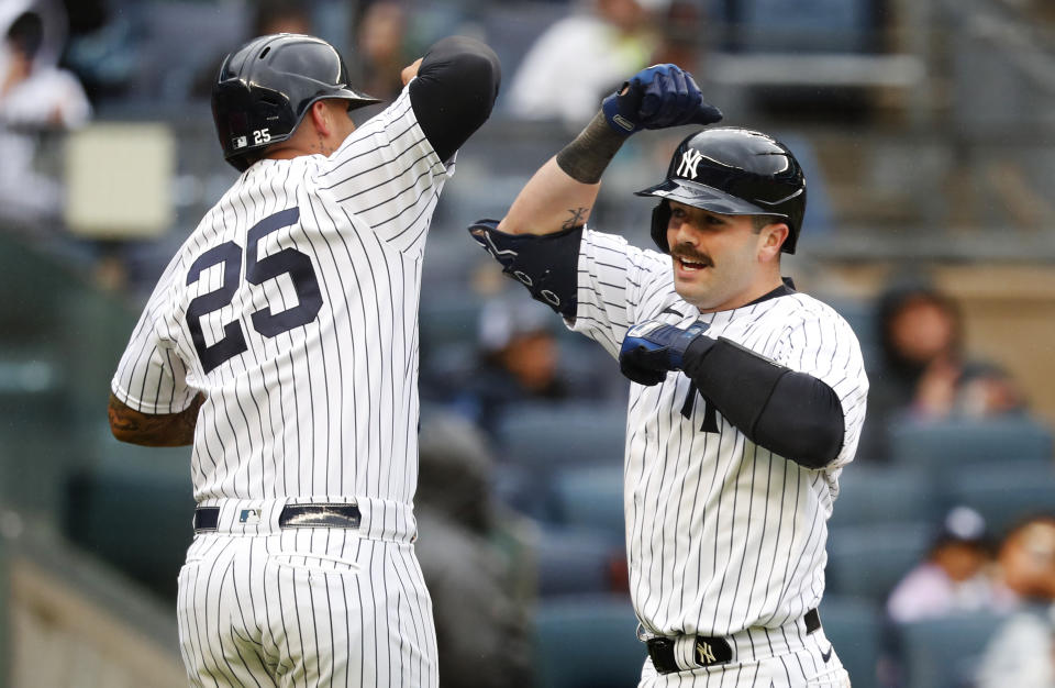 New York Yankees' Austin Wells celebrates with Gleyber Torres (25) after hitting a home run against the Arizona Diamondbacks during the fourth inning of a baseball game, Monday, Sept. 25, 2023, in New York. (AP Photo/Noah K. Murray)