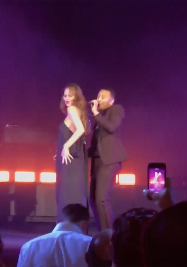 Chrissy danced on her husband at the concert. Source: Twitter/kentrazon