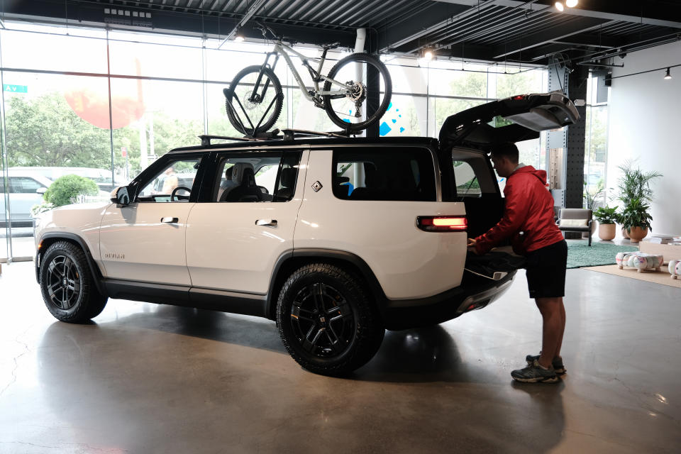 NEW YORK, NEW YORK - JUNE 23: Taylor looks at Rivian electric trucks at the auto maker's newly opened storefront in the Meatpacking District of Manhattan on June 23, 2023 in New York City. The 5,000-square-foot location, Rivian’s first on the East Coast, displays its R1T and R1S electric vehicles and offers merchandise, test drives and a lounge and activity space for children. The Manhattan showroom is a temporary location until Rivian opens its permanent New York location in Brooklyn’s trendy Williamsburg neighborhood.  (Photo by Spencer Platt/Getty Images)