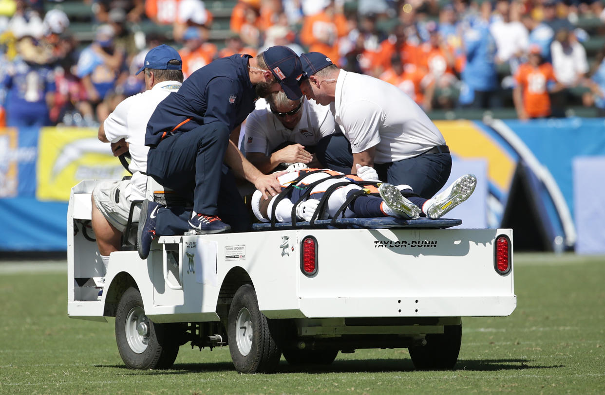 DeVante Bausby of the Denver Broncos was carted off the field in the first half on Sunday against the Chargers. (Getty Images)