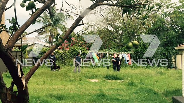 Tactical officers in the backyard of a Liverpool home. Photo: 7News