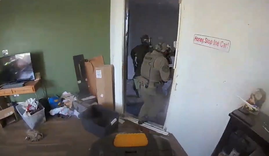 <em>The video released from police showed that around the 21st hour of the barricade police said that Henderson SWAT and Crisis Negotiation teams moved in to assist police and entered an unoccupied part of the home. (Henderson Police Department)</em>