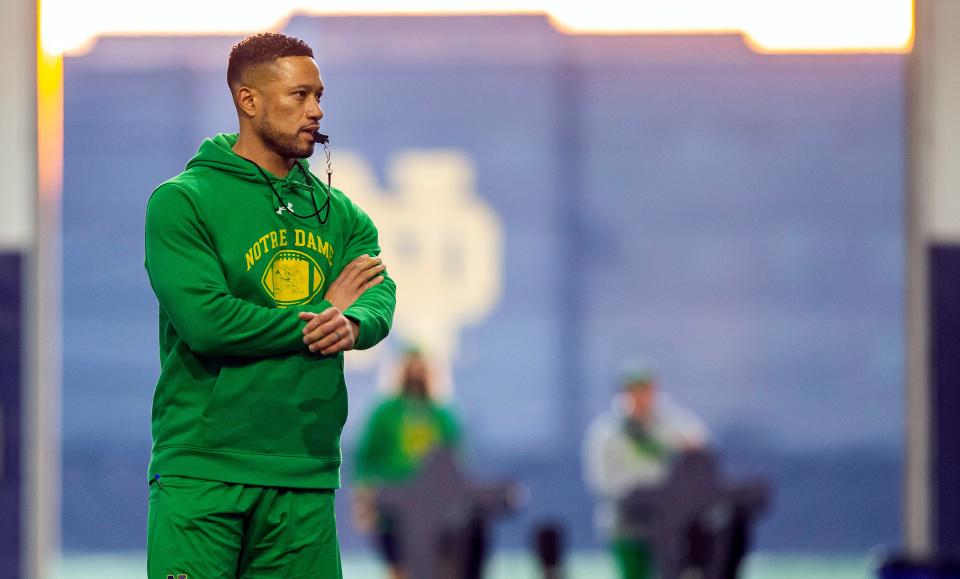 FILE - Notre Dame head coach Marcus Freeman watches spring NCAA college football practice on March 17, 2022, in South Bend, Ind. The Fighting Irish open the season at No. 2 Ohio State on Saturday, Sept. 3. Freeman understands the intrigue of this matchup better than most. (Robert Franklin/South Bend Tribune via AP)