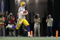 LSU quarterback Joe Burrow (9) runs against Georgia during an NCAA college football game for the Southeastern Conference championship Saturday, Dec. 7, 2019, in Atlanta, Ga. (C.B. Schmelter/Chattanooga Times Free Press via AP)