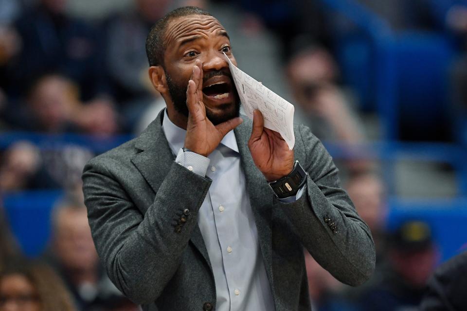 Connecticut associate head coach Kimani Young calls out to players during the second half of an NCAA college basketball game against Villanova, Tuesday, Feb. 22, 2022, in Hartford, Conn. (AP Photo/Jessica Hill)