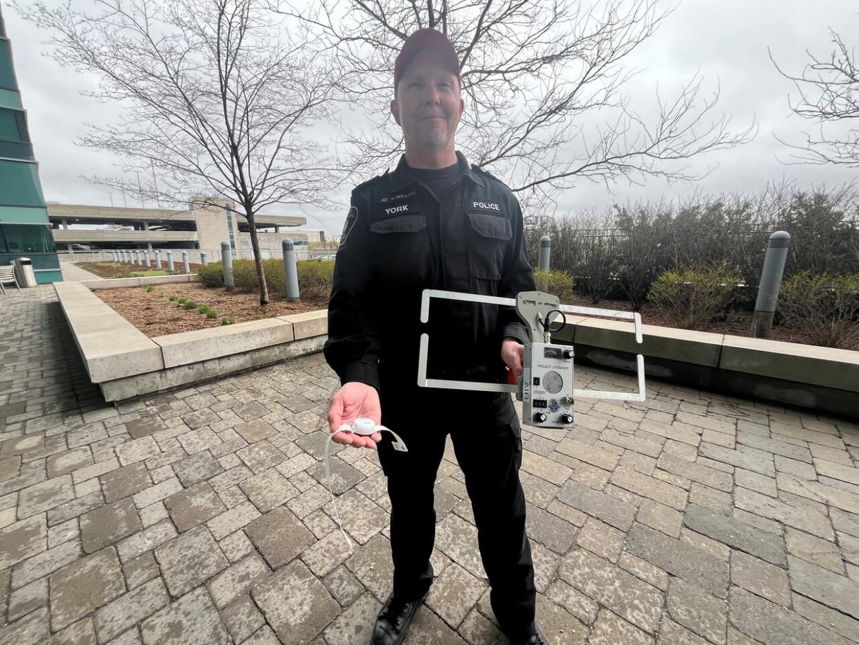 Project Lifesaver assists police in finding missing people using a wristband that emits a tracking signal. (Dale Manucdoc/CBC News - image credit)