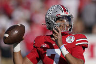 FILE - Ohio State quarterback C.J. Stroud throws during the first half in the Rose Bowl NCAA college football game against Utah, Jan. 1, 2022, in Pasadena, Calif. A Buckeyes attack that led the nation with 561 yards and nearly 46 points per game returns quarterback C.J. Stroud, leading receiver Smith-Njigba, 1,200-yard rusher TreVeyon Henderson and an experienced offensive line anchored by 6-foot-8, 360-pound right tackle Dawand Jones. (AP Photo/Mark J. Terrill, File)