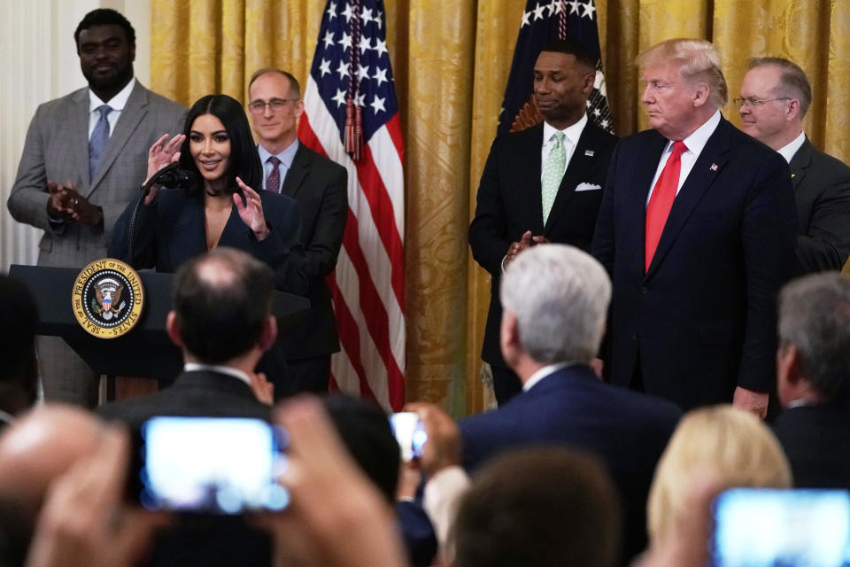 WASHINGTON, DC - JUNE 13:  Kim Kardashian West speaks as U.S. President Donald Trump listens during an East Room event on “second chance hiring” June 13, 2019 at the White House in Washington, DC. President Donald Trump held the event to highlight the achievements on Second Chance hiring and workforce development.  (Photo by Alex Wong/Getty Images)