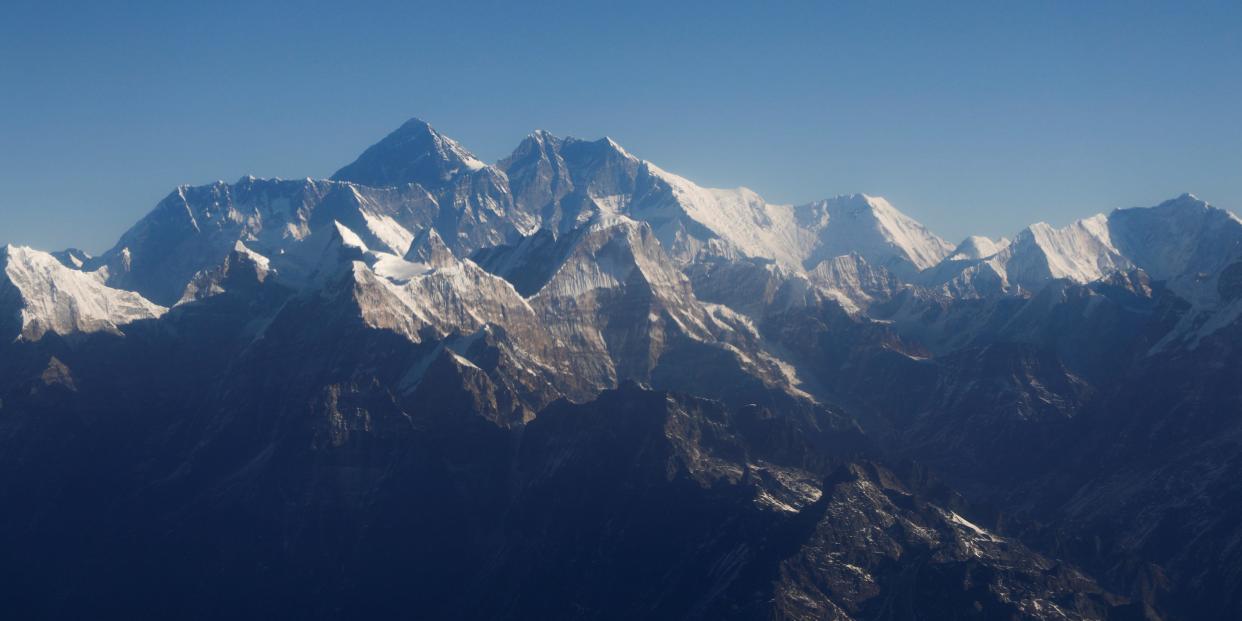 Mount Everest, the world highest peak, and other peaks of the Himalayan range are seen through an aircraft window during a mountain flight from Kathmandu in January 2020.