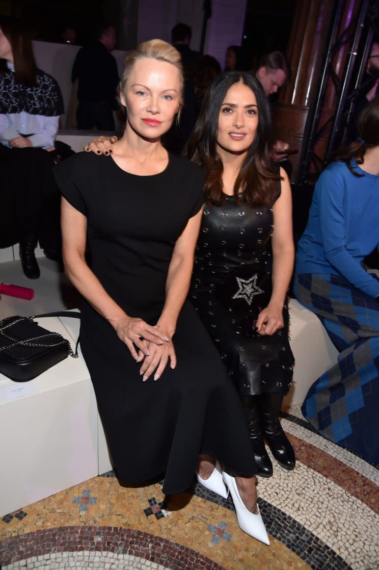 Pamela Anderson and Salma Hayek attend the Stella McCartney Fall/Winter 2017 show in Paris, France. (Photo: Getty)