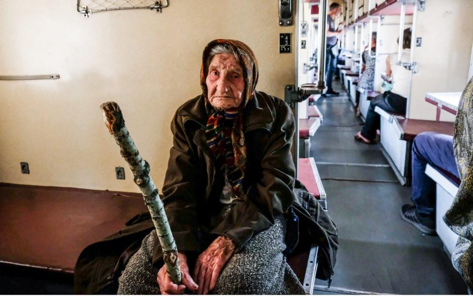 An elderly woman being evacuated on a train to Dnipro on May 31, 2022 - Rick Mave/SOPA Images