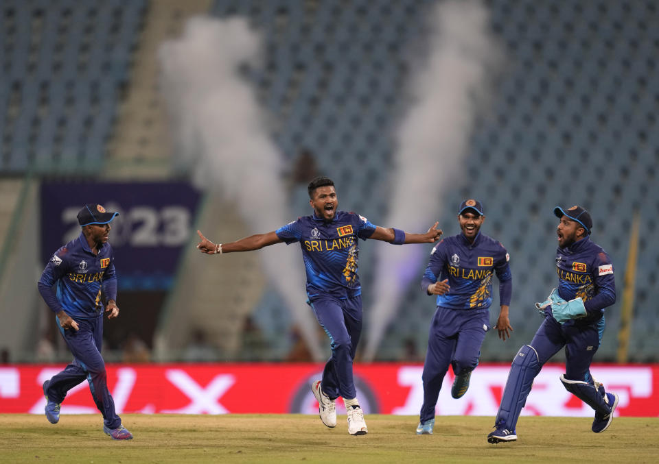 Sri Lanka's Dilshan Madushanka celebrates the wicket of Australia's Steve Smith during the ICC Men's Cricket World Cup match between Australia and Sri Lanka in Lucknow, India, Monday, Oct. 16, 2023. (AP Photo/Aijaz Rahi)