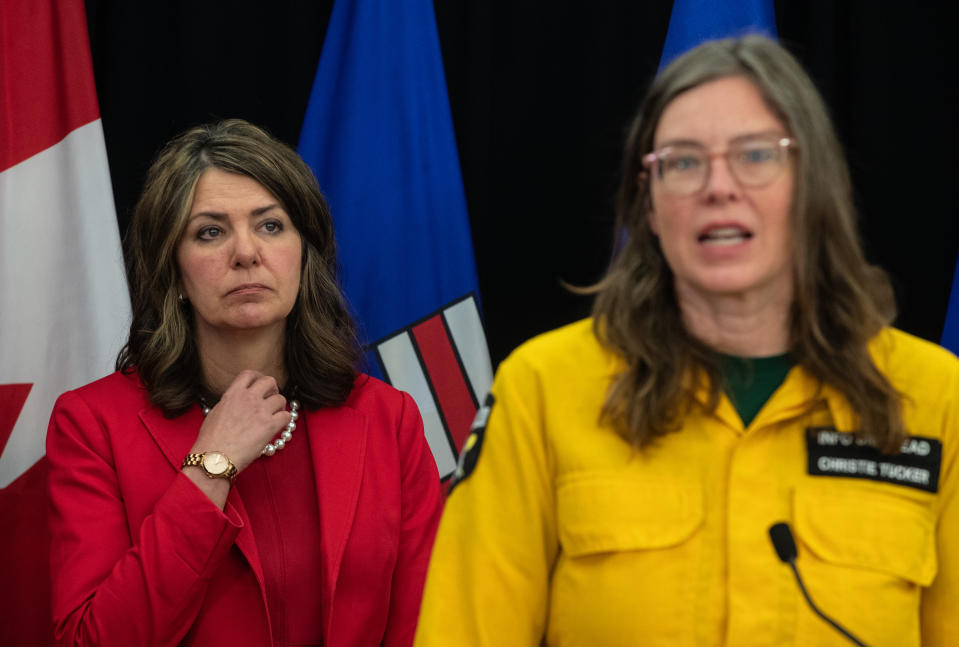 <p>Alberta Premier Danielle Smith watches as Alberta Wildfire information unit manager Christie Tucker gives an update on the Alberta wildfire situation, in Edmonton on Wednesday May 15, 2024.</p> 