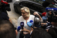 Marine Le Pen, leader the French far-right, arrives at the National Rally party headquarters, Monday, July 1, 2024 in Paris. France's National Rally surged into the lead in the first round of legislative elections, according to results released early Monday, bringing the far-right party to the brink of power and dealing a major blow to President Emmanuel Macron's centrists in an election that could set the country, and Europe, on a starkly different course. (AP Photo/Louise Delmotte)