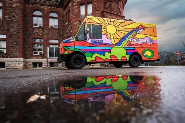 Creative director and graphic artist Andrew Lewis designed a program for Canada Post last year to thank the corporation's employees for their service during the pandemic. Today, his art is roaming across the country on four wheels. 