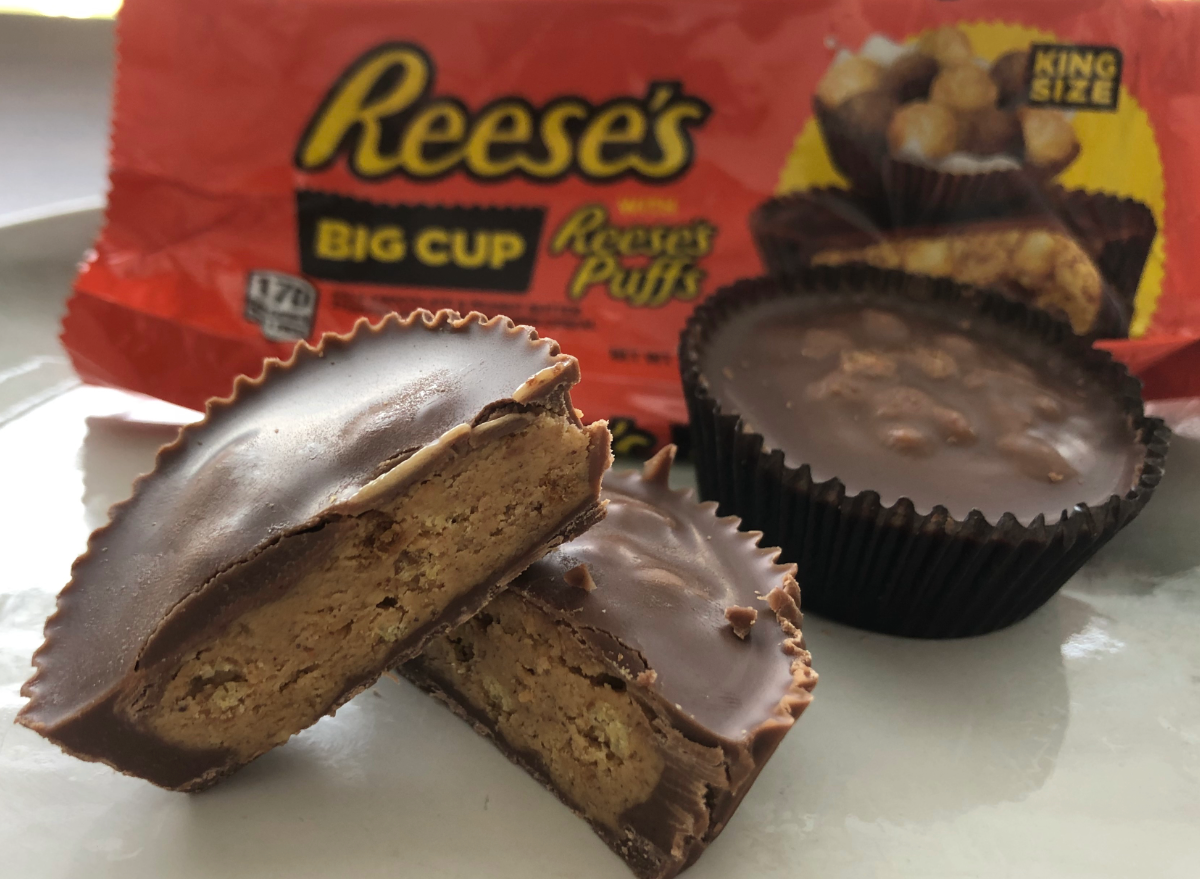 reeses big cups broken open in front of wrapper.