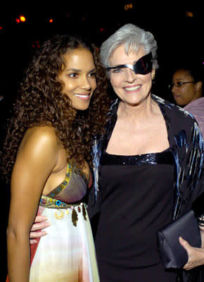 Catwomen Halle Berry and Lee Meriwether at the Hollywood premiere after-party for Warner Brothers' Catwoman