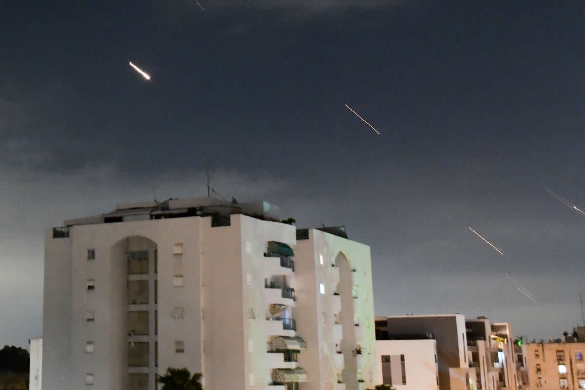 Israeli Iron Dome air defence system launches to intercept missiles fired from Iran, in central Israel on Sunday (AP)
