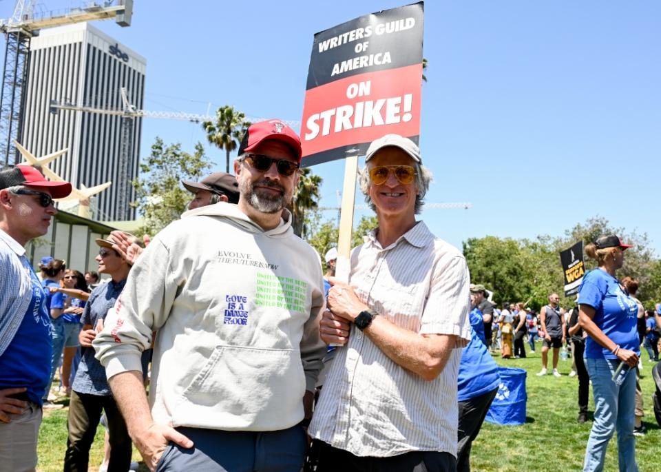 Jason Sudeikis and Jay Roach gather in support of the 2023 Writers Guild of America strike at La Brea Tar Pits in Los Angeles, California on June 21, 2023.