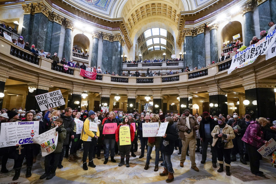 Protesters are seen in the Wisconsin Capitol Rotunda during a march supporting overturning Wisconsin's near total ban on abortion, Jan. 22, 2023, in Madison, Wis. Planned Parenthood has resumed offering abortions in Wisconsin at clinics in Madison and Milwaukee. The resumption of services on Monday Sept. 18 2023 is the first time abortions have been available in the state since the U.S. Supreme Court overturned Roe v. Wade in June 2022. (AP Photo/Morry Gash)