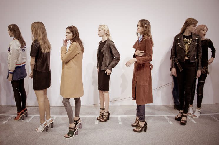 Models prepare backstage for the Carven show — part of the Paris Fashion Week Womenswear Spring/Summer 2016 —on Oct. 1, 2015, in Paris. France. (Photo by Francois G. Durand/WireImage)