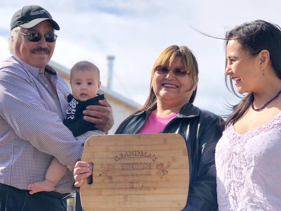 John Steen, granddaughter Ariya Ray, Joanne Edwards-Steen and Shelby Steen, the family behind Grandma's Kitchen in Tuktoyaktuk, N.W.T. (Karli Zschogner/CBC - image credit)