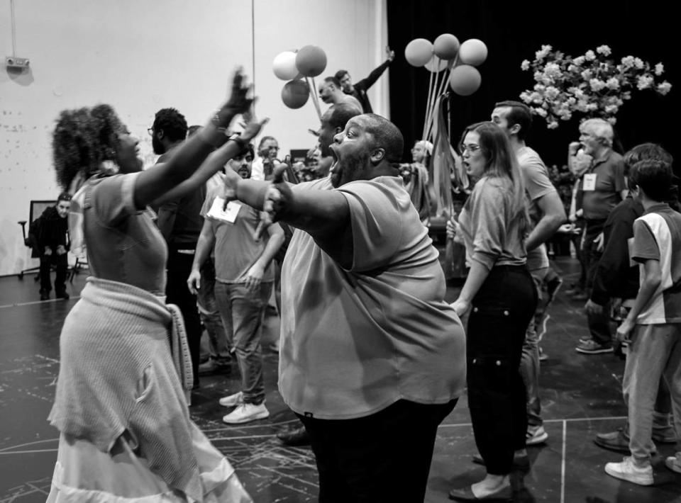 Opera singers Kearstin Piper Brown, left, and Limmie Pulliam, right, rehearse with cast members inside the Balfe Rehearsal Hall in Doral, Florida. Carl Juste/cjuste@miamiherald.com