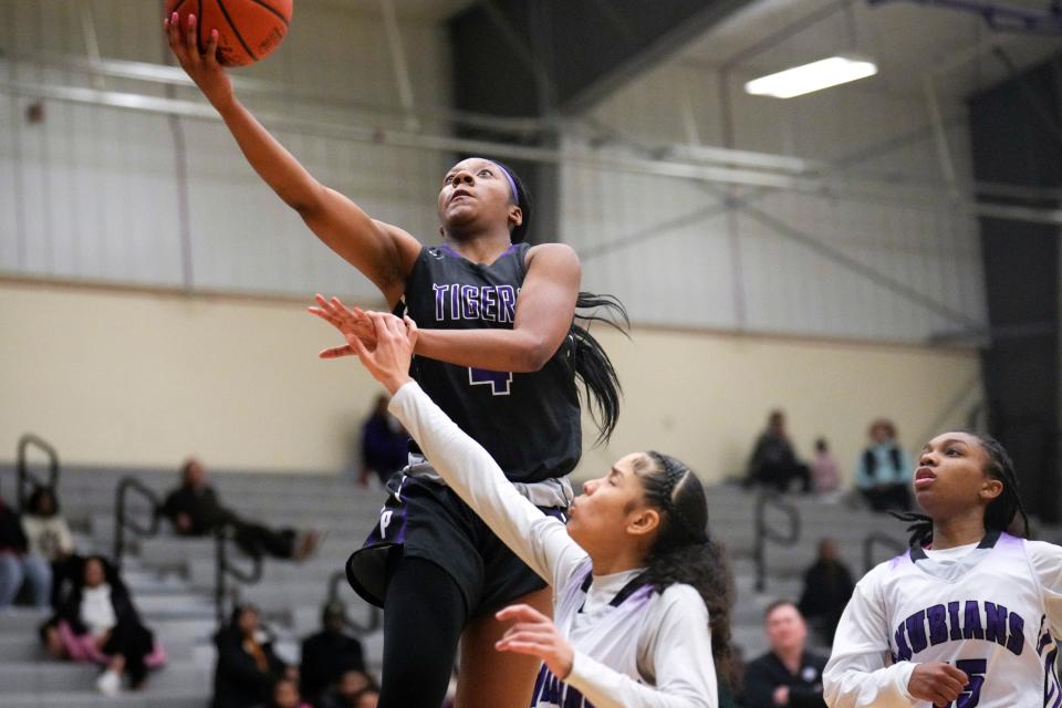 Pickerington Central High School’s Madison Greene makes a shot attempt while defended by Africentric’s Rayanna Howell during the fourth quarter of the girls basketball game, Jan. 29. 2023, in Columbus.