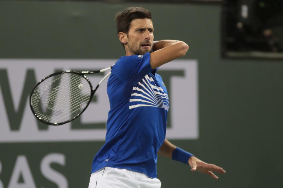 Novak Djokovic returns to Bjorn Fratangelo in the first set of their match at the BNP Paribas Open, Indian Wells, Calif., March 9, 2019.